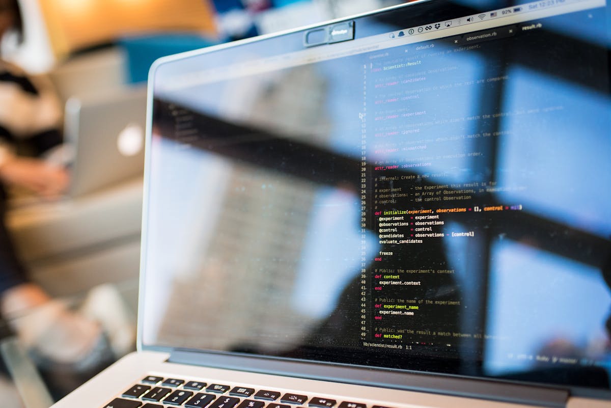 Laptop displaying code with reflection. Photo by Christina Morillo on Pexels.